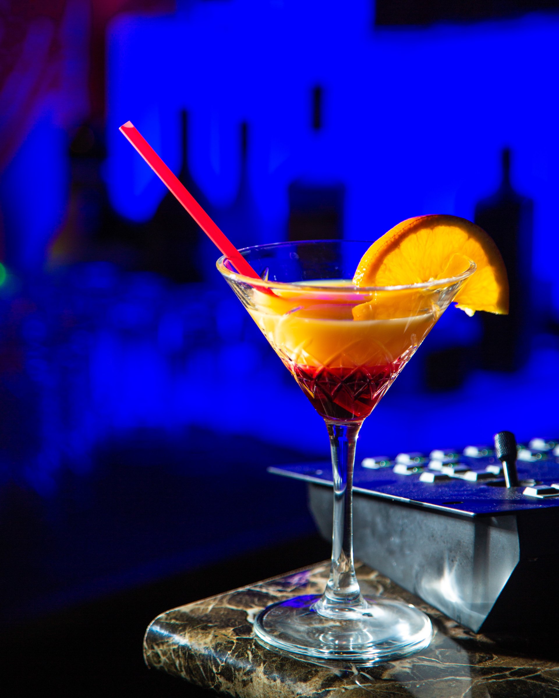 a cocktail, orange slice